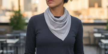 Person wearing a cooling bandana around the neck in hot outdoor conditions.