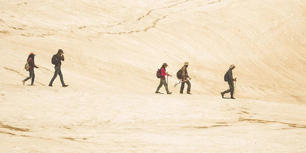 Hikers on top of a desert hill
