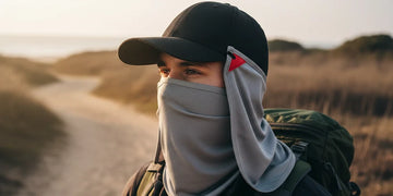Hiker wearing UPF neck drape outdoors in bright sunlight.