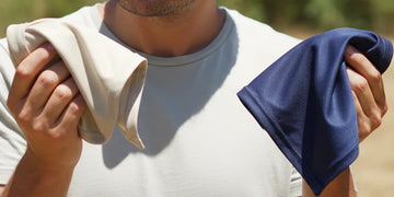 Person choosing between a cooling towel and cooling bandana in heat.