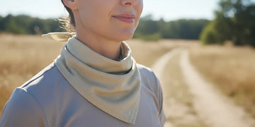 Person wearing UPF sun protection clothing in bright sunlight.